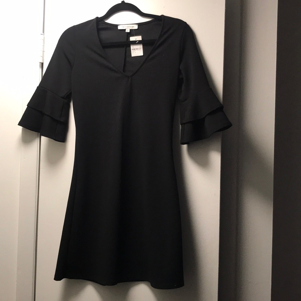 Little black dress with bell sleeves